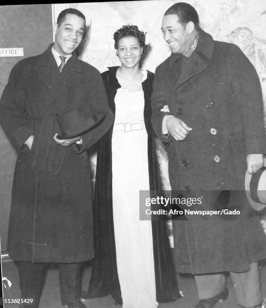 African-American composer, pianist, bandleader and Jazz musician Duke Ellington, Mercer Kennedy Ellington and Jeni LeGon smiling at the Cotton Club...