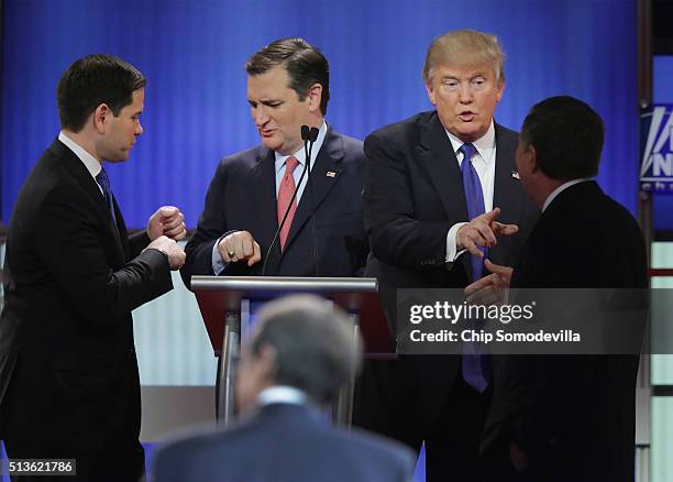 Republican presidential candidates Sen. Marco Rubio , Sen. Ted Cruz , Donald Trump and Ohio Gov. John Kasich greet each following a debate sponsored...