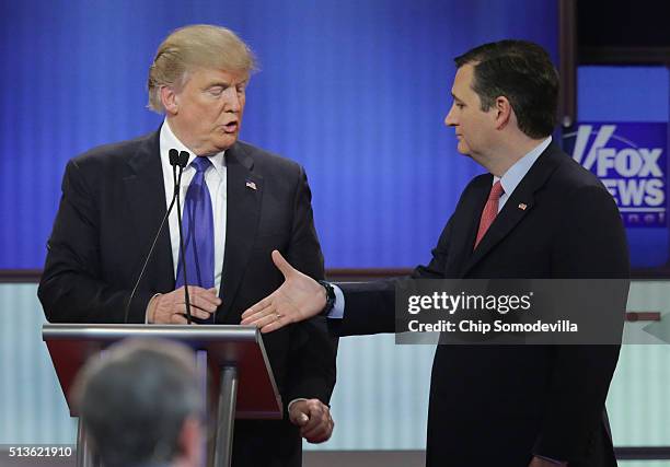 Republican presidential candidates Donald Trump and Sen. Ted Cruz greet each following a debate sponsored by Fox News at the Fox theatre on March 3,...