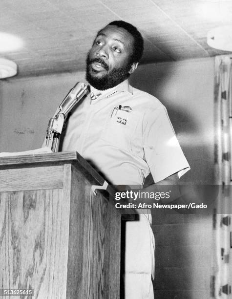 Writer and social activist Dick Gregory speaking at a podium, 1968.