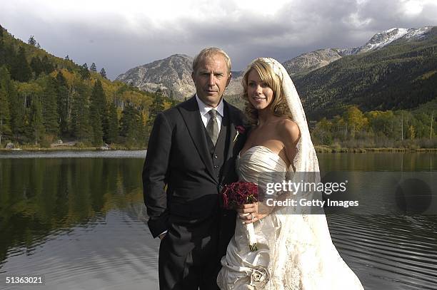 Actor Kevin Costner poses with his new wife Christine Baumgartner during their private wedding at his ranch in September 25, 2004 in Aspen, Colorado.