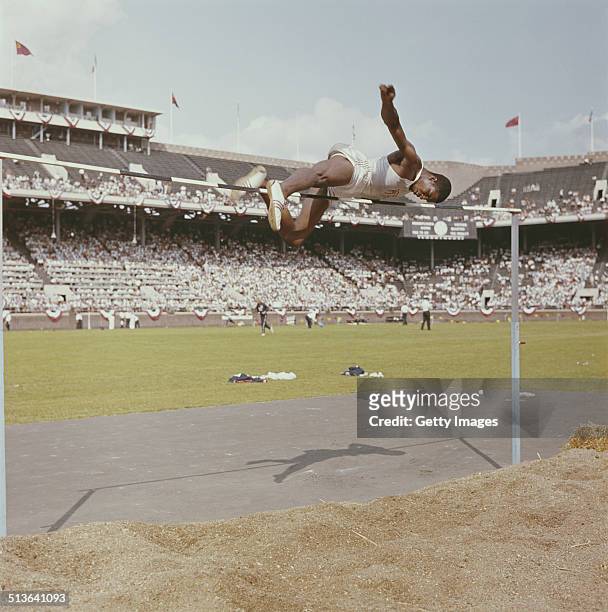Charles Dumas of the United States, winner of the High Jump Gold medal at the1956 Melbourne Summer Olympics Games competes during a USA versus USSR...