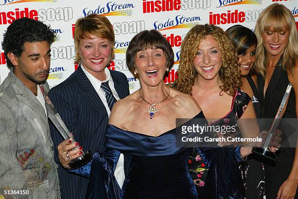 Actors Ray Panthaki, Laurie Brett, June Brown, Tracy-Ann Oberman, Pooja Shah and Jemma Walker of "EastEnders" pose backstage during the "Inside Soap...