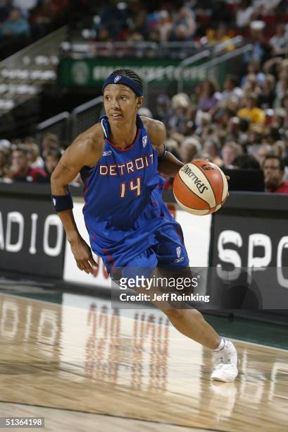 Deanna Nolan of the Detroit Shock drives against the Seattle Storm during the game at Key Arena on September 8, 2004 in Seattle, Washington. The...