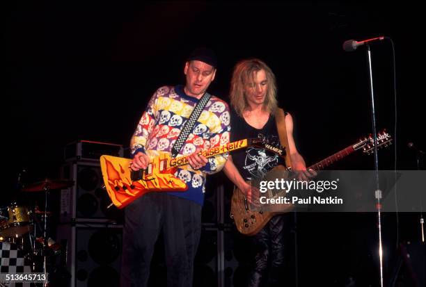 American musicians Rick Nielsen and Robin Zander of the band Cheap Trick perform at the Riviera Theater, Chicago, Illinois, December 31, 1988.