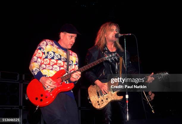 American musicians Rick Nielsen and Robin Zander of the band Cheap Trick perform at the Riviera Theater, Chicago, Illinois, December 31, 1988.