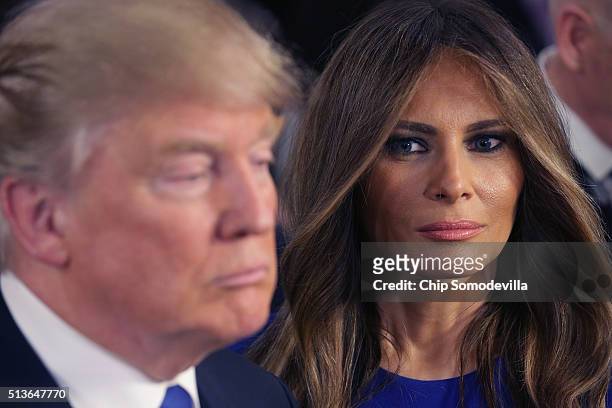 Republican presidential candidate Donald Trump and his wife Melania greet reporters in the spin room following a debate sponsored by Fox News at the...
