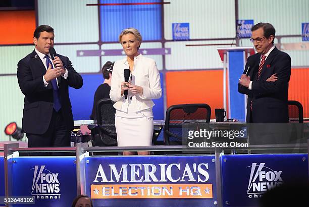 Moderators Bret Baier, Megyn Kelly and Chris Wallace are introduced at the Republican presidential debate sponsored by Fox News at the Fox Theatre on...