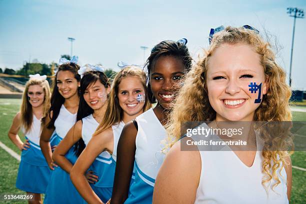 cheerleaders - cheerleaders stock pictures, royalty-free photos & images
