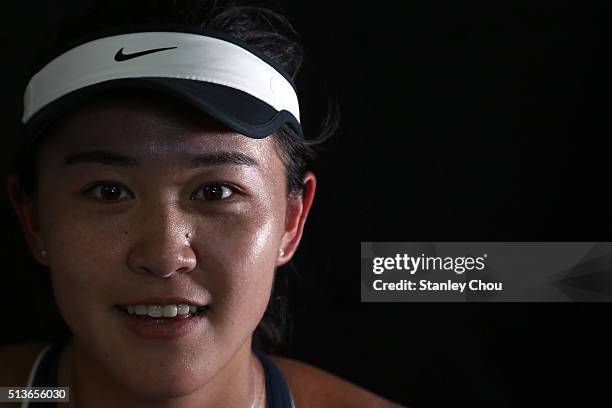 Lin Zhu of China poses at the post match press conference after she defeated her compatriot Qiang Wang during the Quarter Finals of the 2016 BMW...