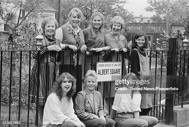 Cast members from television soap opera EastEnders pictured together on the Albert Square set at Elstree Studios in Elstree, England in 1985....