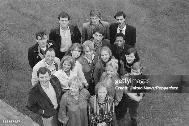 Cast members from the BBC television soap opera EastEnders pictured together on the Albert Square set at Elstree Studios in Elstree, England in 1985....