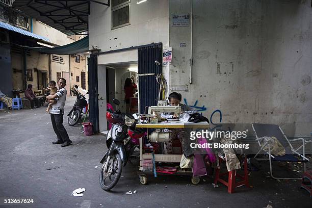 Seamstress sews clothing in an alleyway in Phnom Penh, Cambodia, on Wednesday, March 2, 2016. By 2030, more than half of 650 million people in...