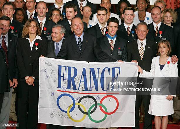 French sports minister Jean-Francois Lamour, swimmer Laure Manaudou, Premier Jean-Pierre Raffarin, President Jacques Chirac, kayakist Tony Estanguet,...