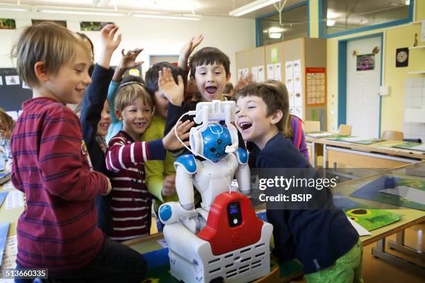 Reportage on the Avatar Kids project, which allows children and teenagers who have to be hospitalised to be present in the classroom through Nao, a...