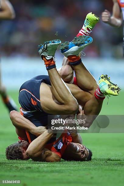 Dylan Shiel of the Giants is tackled by Tom Papley of the Swans during the 2016 AFL NAB Challenge match between the Sydney Swans and the Greater...