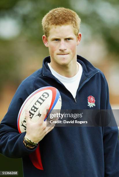 Prince Harry helps RFU Rugby Development Officiers coach children at Greenfield Primary School, Shelfield, on September 28, 2004 in Walsall, England.