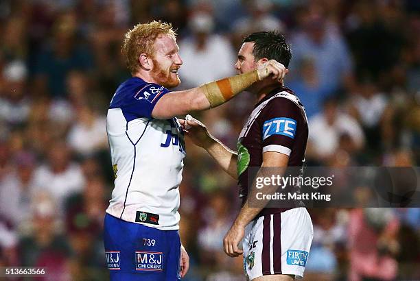 James Graham of the Bulldogs gestures with a forearm after a high tackle by Steve Matai of the Sea Eagles as Jamie Lyon of the Sea Eagles looks on...