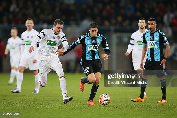 Tommy Untereiner of Granville and Abdelaziz Barrada of Marseille during the French Cup game between US Granville V Olympique de Marseille at Stade...