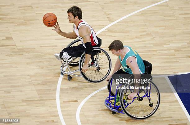 Travis Gaertner of Canada takes off on a fast break against Shaun Norris of Australia during their gold medal wheelchair basketball game on September...