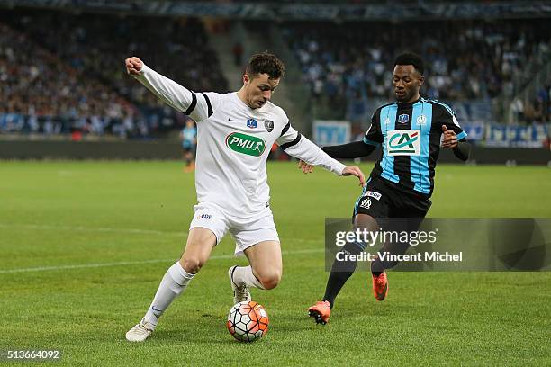 Pierre Lemonier of Granville and Georges Kevin Nkoudou of Marseille during the French Cup game between US Granville V Olympique de Marseille at Stade...