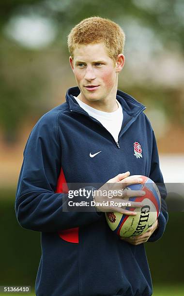 Prince Harry helps RFU Rugby Development Officiers coach children at Greenfield Primary School, Shelfield, on September 28, 2004 in Walsall, England.