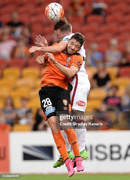 Brandon Borrello of the Roar and Scott Jamieson of the Wanderers challenge for the ball during the round 22 A-League match between the Brisbane Roar...