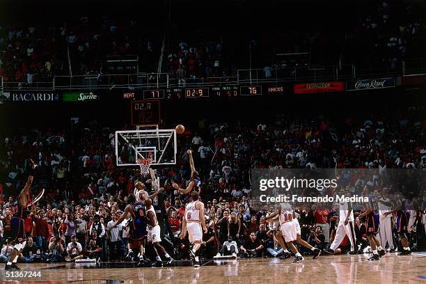 Allan Houston of the New York Knicks drives through the lane for a last-second game and series-winning shot against the Miami Heat during the first...