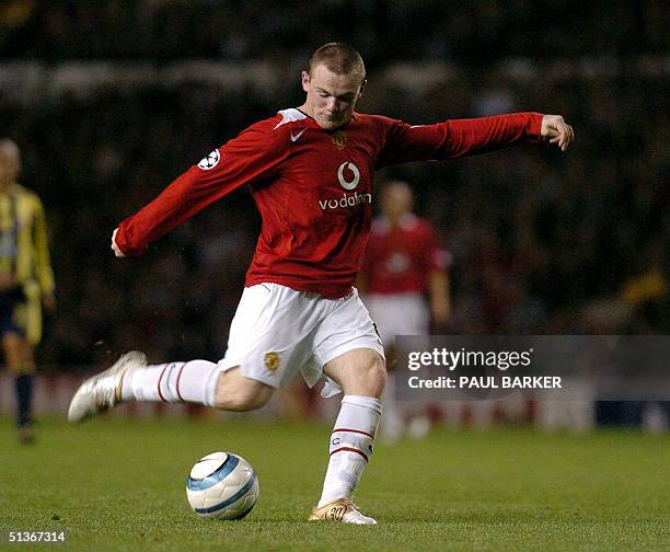 Manchester United's Wayne Rooney shoots to score against Fenerbahce during their Champion's League football match at Old Trafford, Manchester, 28...