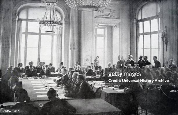 Treaty of Versailles is negotiated by delegates in May 1919.