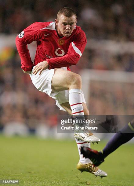 Wayne Rooney of Manchester United scores the third goal during the UEFA Champions League match between Manchester United and Fenerbahce at Old...