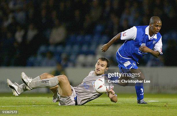 Darren Byfield of Gillingham gets away from Nikos Dabizas of Leicester City during the Coca-Cola Championship match between Gillingham and Leicester...