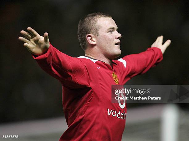 Wayne Rooney of Manchester United celebrates scoring the third goal during the UEFA Champions League match between Manchester United and Fenerbahce...