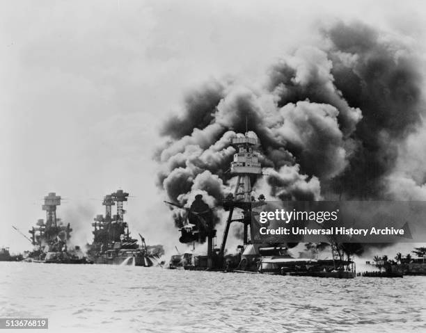 Three stricken US battleships. Left to right, West Virginia, Tennessee and Arizona after the Japanese attack on Pearl Harbour in World War II, 1941.