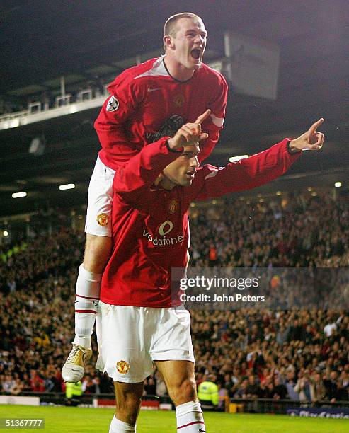 Ruud van Nistelrooy of Manchester United celebrates scoring the seventh goal of the game with Wayne Rooney during the UEFA Champions League match...