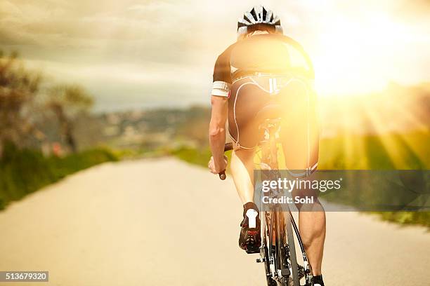 one man and his bicycle - racing cyclist stockfoto's en -beelden