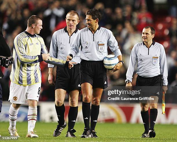 Wayne Rooney of Manchester United tries to get the match ball of the referee after a hat-trick on debut during the UEFA Champions League Group D...