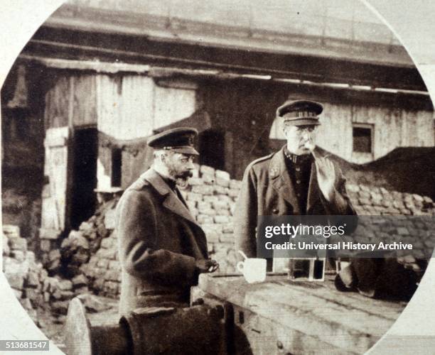 Photograph of King George V and King Albert I of Belgium eating near the Mole at Zeebrugge. Dated 1918