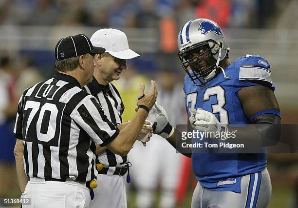 Tackle Stockar McDougle of the Detroit Lions talks to the officials during the game against the Houston Texans at Ford Field on September 19, 2004 in...