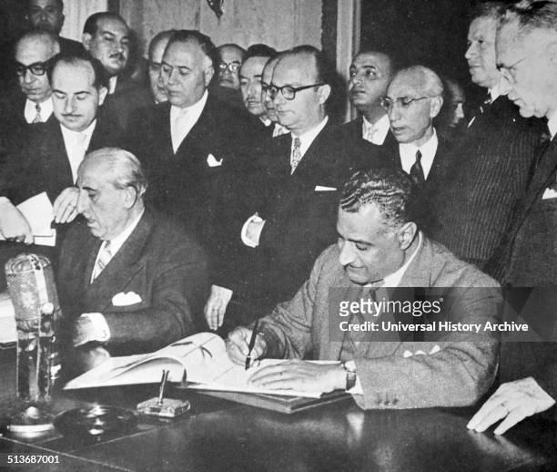 Nasser signing unity pact with Syrian president Shukri al-Quwatli, forming the United Arab Republic, February 1958 a political union between Egypt...