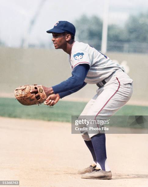 Ernie Banks of the Chicago Cubs focuses on home plate as he fields his position during a game circa 1953-1971.