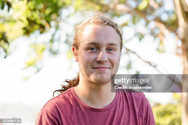 portrait of nineteen years old young man looking at camera - 18 19 years stock pictures, royalty-free photos & images