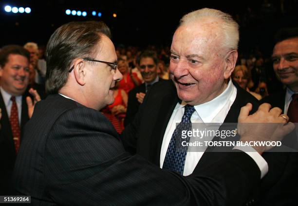 Federal opposition leader Mark Latham and former Labor prime minister Gough Whitlam embrace at the Labor Party campaign launch in Brisbane, 29...