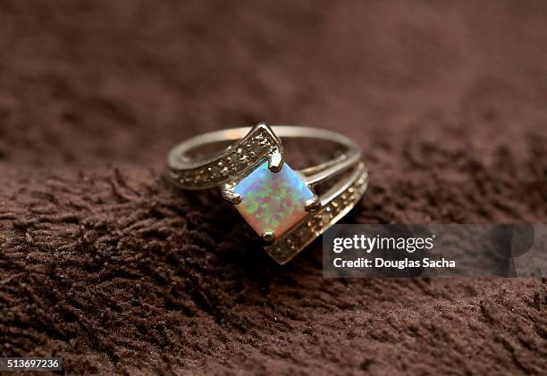 gold ring set with opal gemstone - opal gem stock pictures, royalty-free photos & images