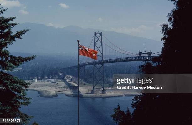Lions Gate Bridge, a suspension bridge across Burrard Inlet from Prospect Point in Stanley Park, Vancouver, British Columbia, Canada, circa 1960. The...
