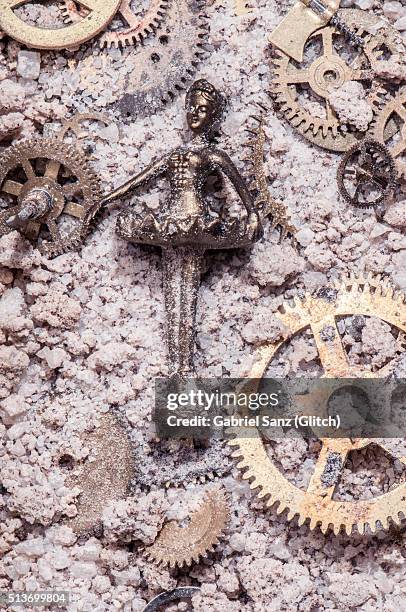 ballet dancer and gears on sand - bailarina stock pictures, royalty-free photos & images