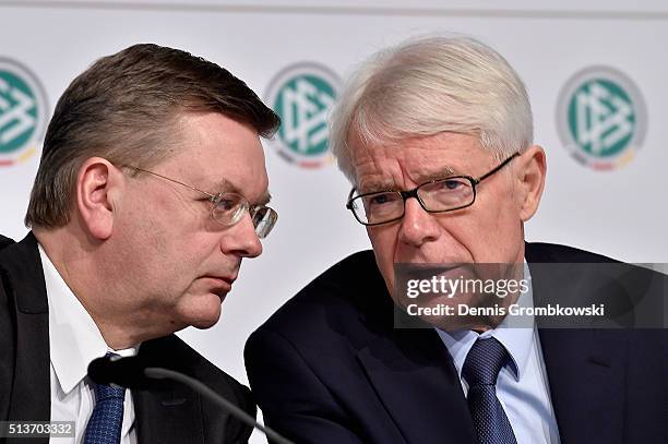 Treasurer Reinhard Grindel and DFB Vice President Reinhard Rauball exchange words during a press conference unveiling the DFB Freshfields Report at...