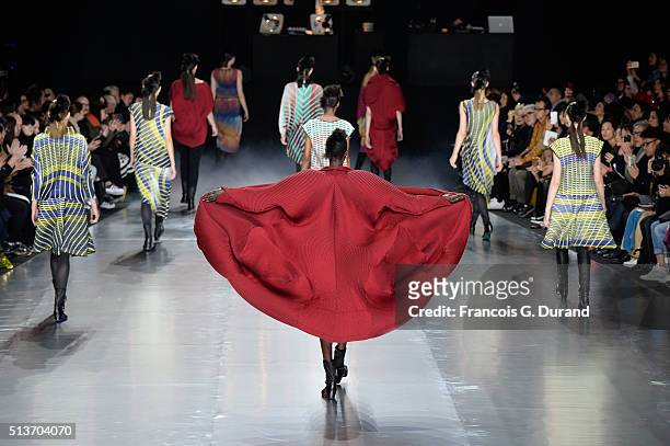 Models on the runway during the Issey Miyake show finale as part of the Paris Fashion Week Womenswear Fall/Winter 2016/2017 on March 4, 2016 in...