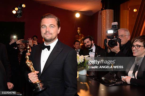 Actor Leonardo DiCaprio, winner of the Best Actor award for 'The Revenant,' poses with his Oscar at the 88th Annual Academy Awards Governors Ball at...