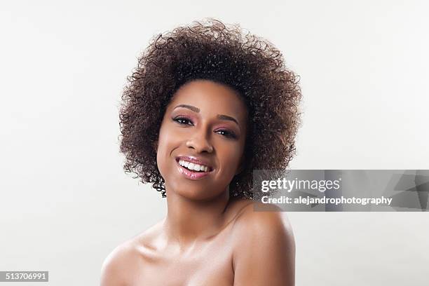ethnic woman with an afro - blonde streak in black hair stock pictures, royalty-free photos & images